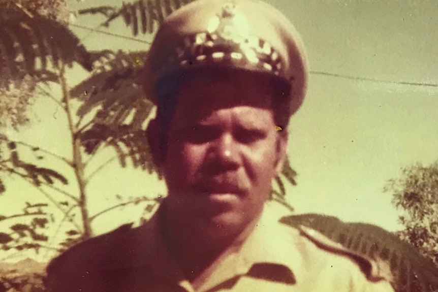 An archive photo of an Indigenous police officer in his uniform