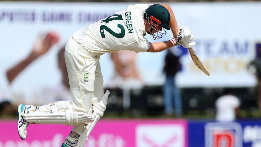 An Australian male batter plays a stroke on day two against Sri Lanka in Galle.
