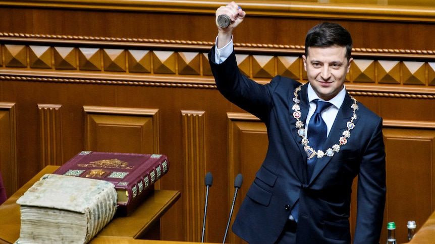 Ukraine's President-elect Volodymyr Zelenskiy takes the oath during his inauguration ceremony in the parliament.