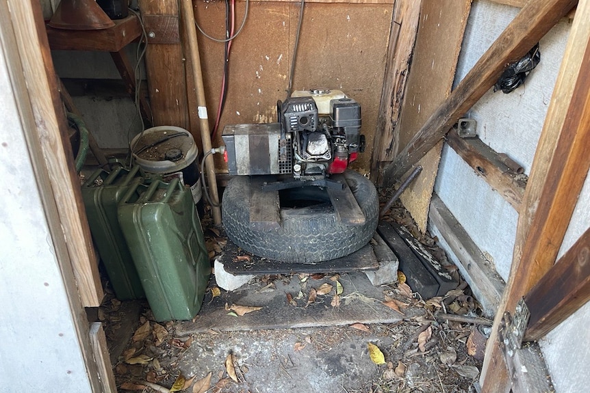 a photo of an old generator in a shed