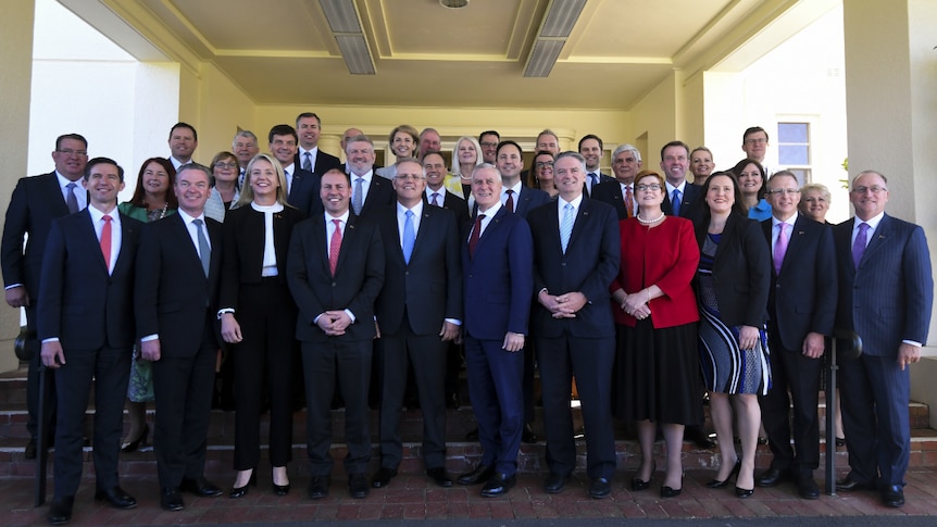 Scott Morrison poses with members of his ministry at the swearing-in ceremony in Canberra.