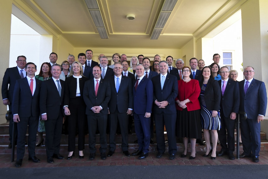 Scott Morrison poses with members of his ministry at the swearing-in ceremony in Canberra.