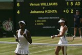 Venus Williams celebrates after beating Britain's Johanna Konta at Wimbledon on July 13, 2017.