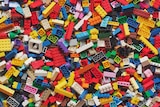 A photo of hundreds of colourful Lego bricks piled up