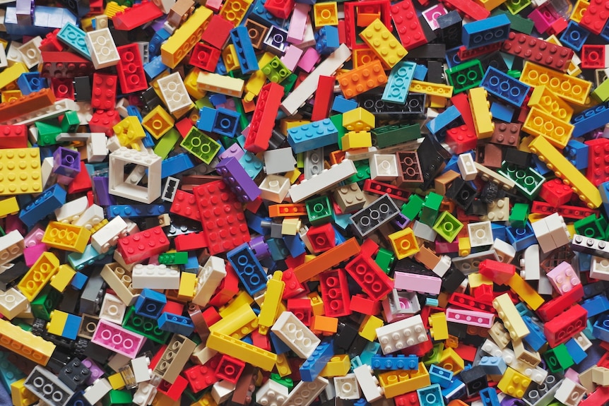 A photo of hundreds of colourful Lego bricks piled up