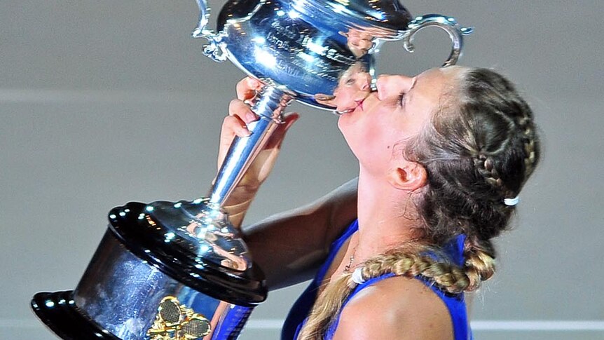 Victoria Azarenka kisses her trophy after defeating Maria Sharapova in the Australian Open women's final on January 28, 2012.