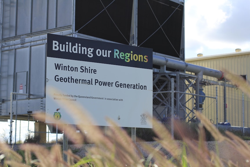 A 'Building Our Regions' sign for a geothermal power plant