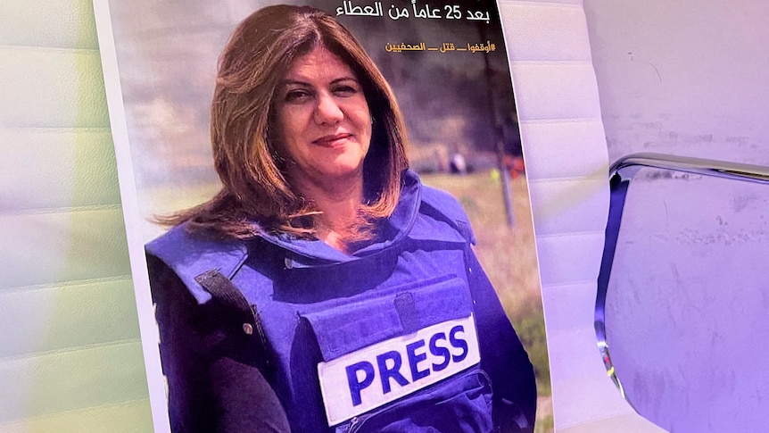 Photo of a woman wearing a PRESS vest.