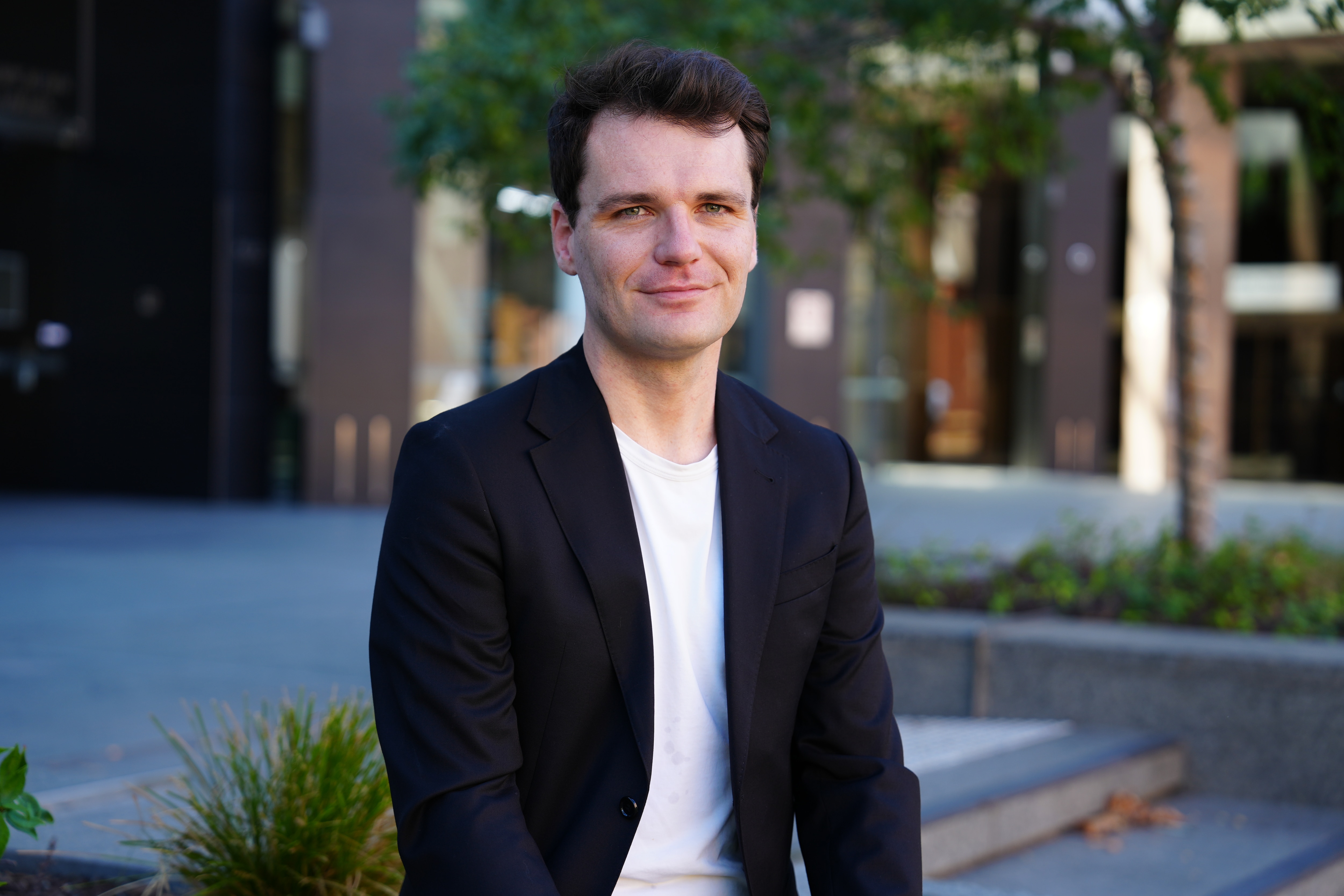 Independent economist Conrad Liveris in a jacket and shirt looking at the camera