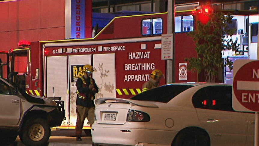 Emergency workers next to a decontamination unit.