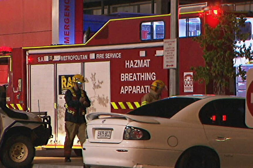 Emergency workers next to a decontamination unit.