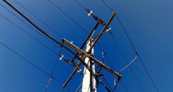 Overhead wires on an electricity pole.