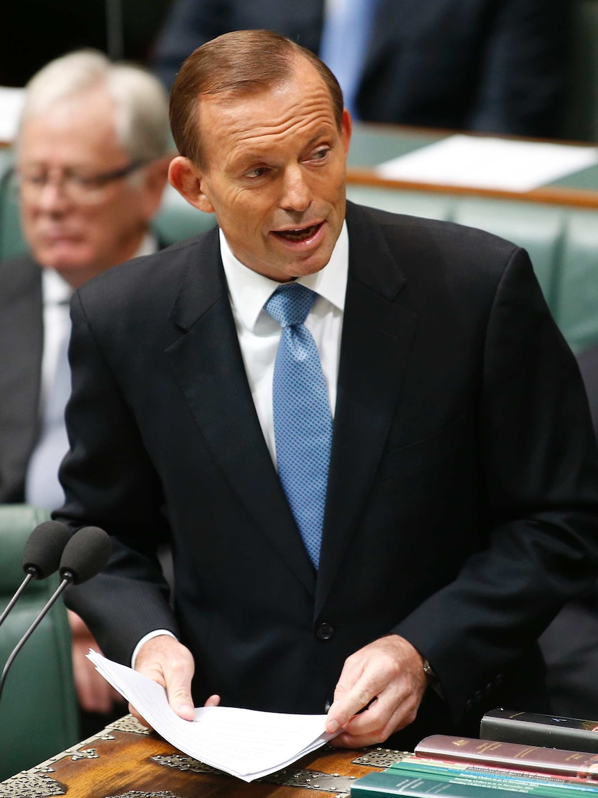 Prime Minister Tony Abbott delivers a statement to the House of Representatives at Parliament House in Canberra.