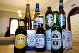 Various brands of beer bottles on display including low-carb beers.