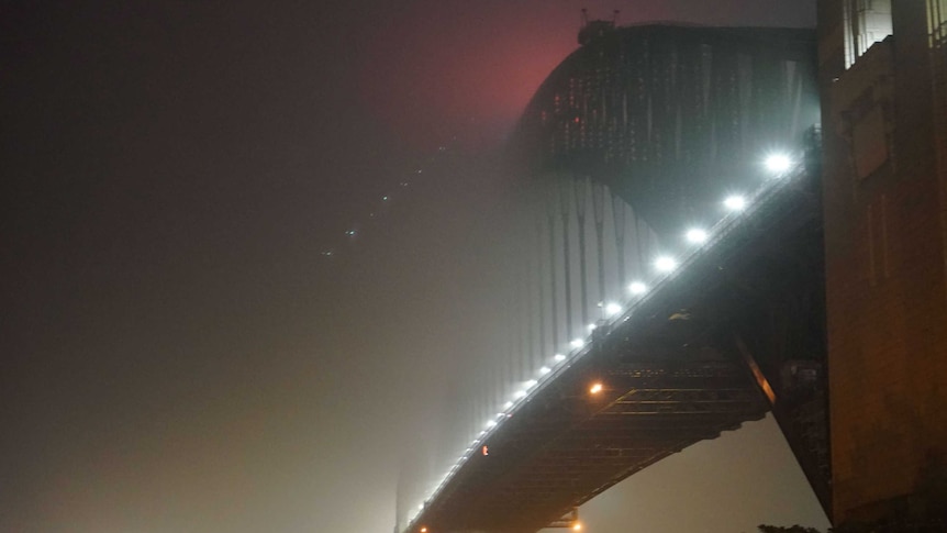 Foggy bridge in the dark.