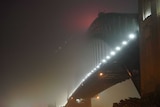 Foggy bridge in the dark.