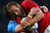 Michalak tackled by Italy defence