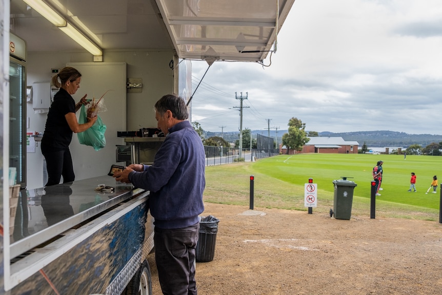 Selling lobsters at a Margate cricket match.