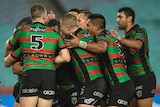 Rabbitohs celebrate a try against Cronulla