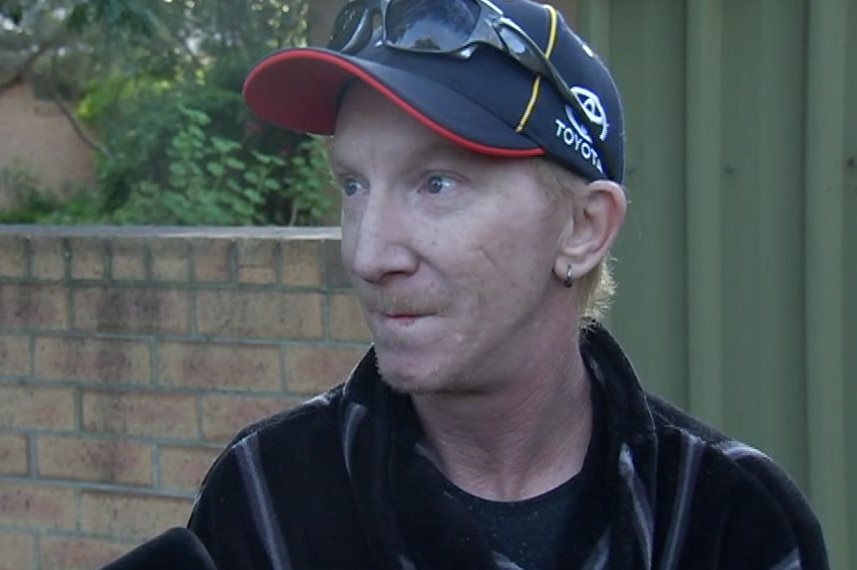 A man wearing a baseball cap