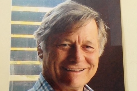 A close up photo of David Graves smiling.