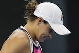 Ashleigh Barty looks downcast after losing a point against Naomi Osaka