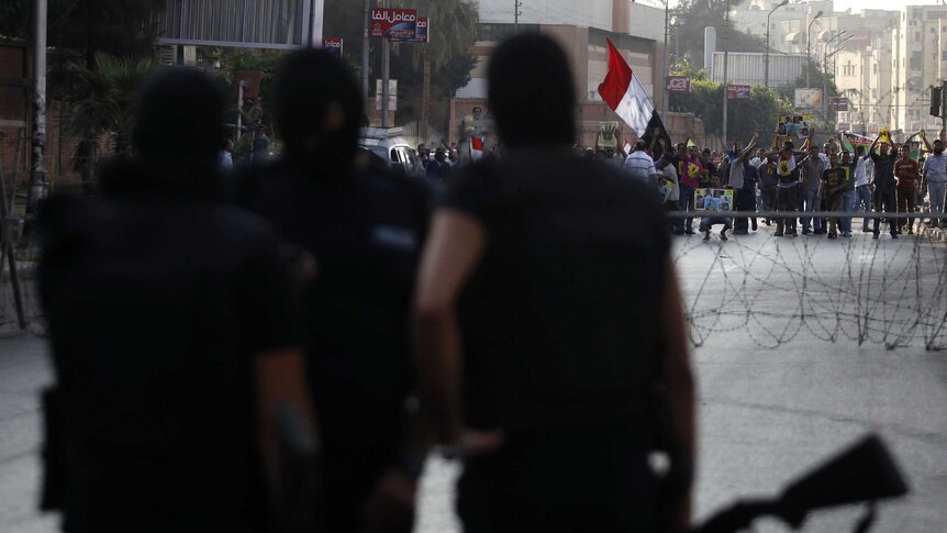 Riot police at a protest in front of the presidential palace in Cairo.