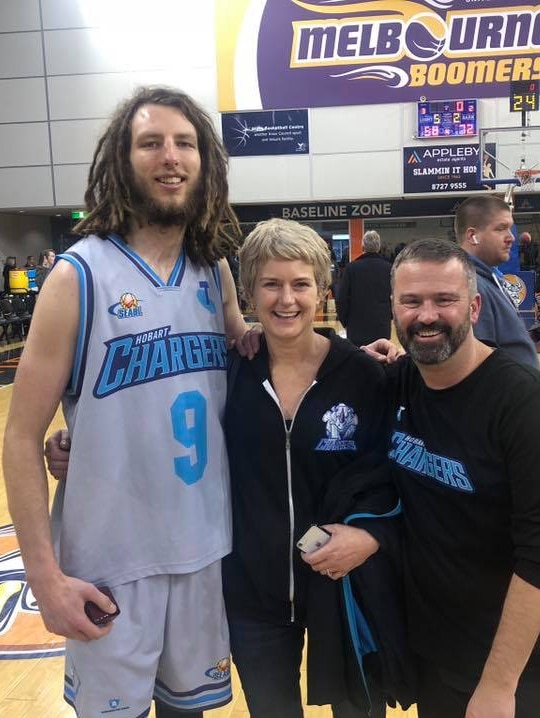 Hobart Chargers basketball star Craig Moller, with club president David Bartlett and wife Larissa.