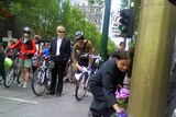 Cyclists laid flowers at the spot where Carolyn Rawlins died.