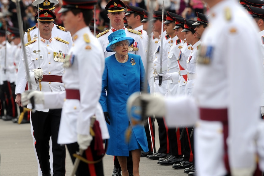 Queen Elizabeth inspects the guard during the presentation of new Queens colours at the Royal Military College Duntroon