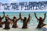 Tokelauns perform a warrior dance to promote action against climate change