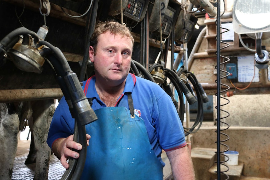 The Manning's dairy manager Matthew Kealy supervising the milk disposal.