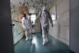 South Korean health officials spray antiseptic solution