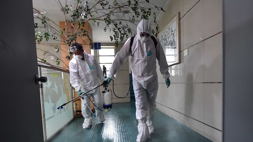 South Korean health officials spray antiseptic solution
