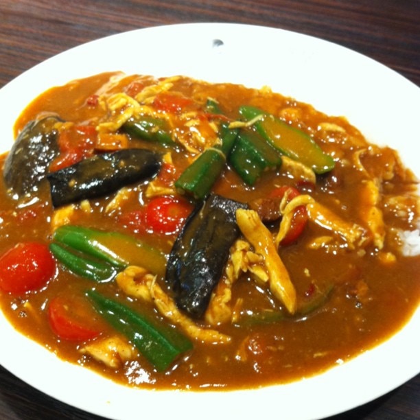 Woman charged after allegedly poisoning colleague's curry with snail pellets