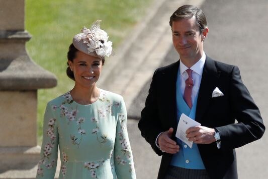 Pippa Middleton and her husband James Matthews arrive for the wedding ceremony.