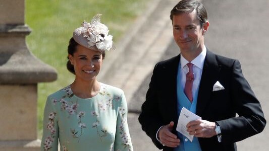 Pippa Middleton and her husband James Matthews arrive for the wedding ceremony.