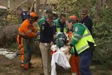SES workers help an injured colleague