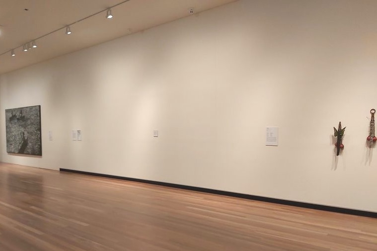 A large empty space between artworks in an art gallery in Mackay