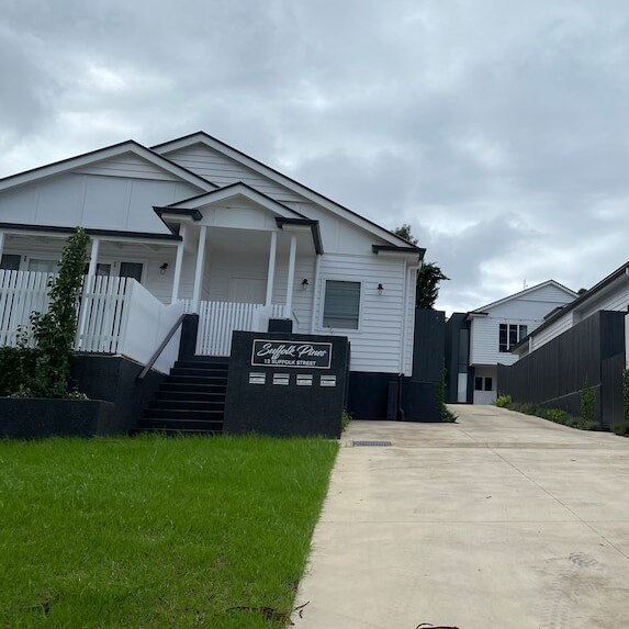 Two newly-built homes sitting side by side in one of Toowoomba's newest housing estates.