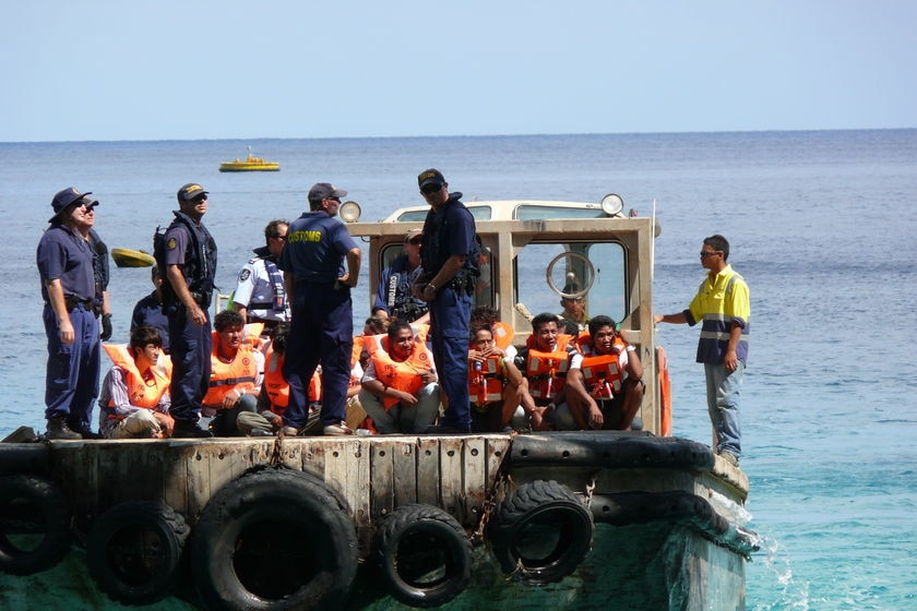 A boat-load of possible asylum seekers is transferred to Christmas Island