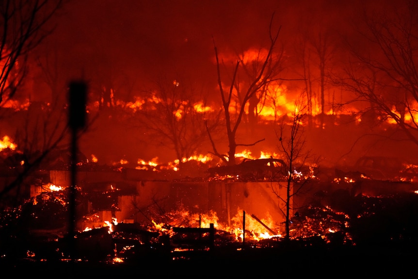 Houses decimated by flames at night in Colorado