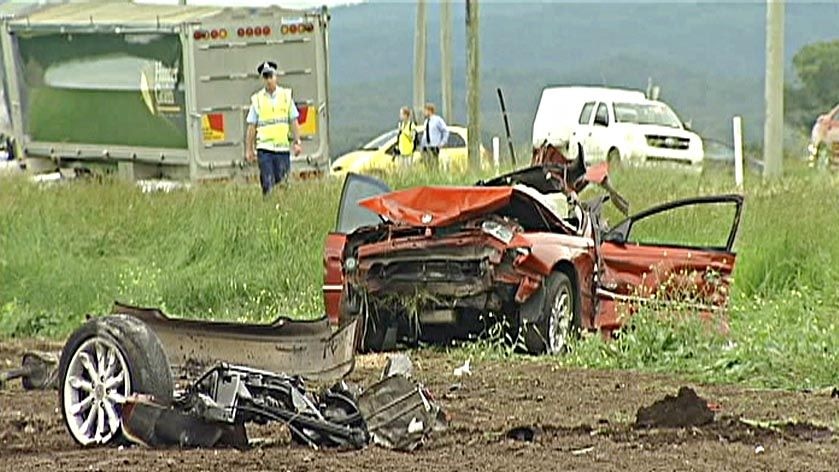 The car and semi-trailer collided head-on.