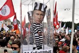 Russian opposition activists demonstrate against Vladimir Putin in Saint Petersburg.