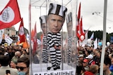 Russian opposition activists demonstrate against Vladimir Putin in Saint Petersburg.