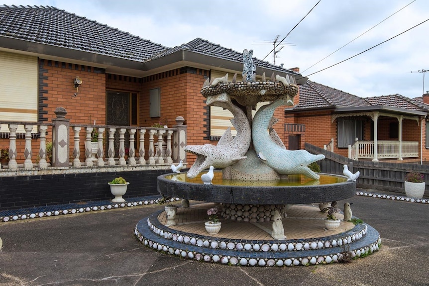 Dolphin fountain in front yard