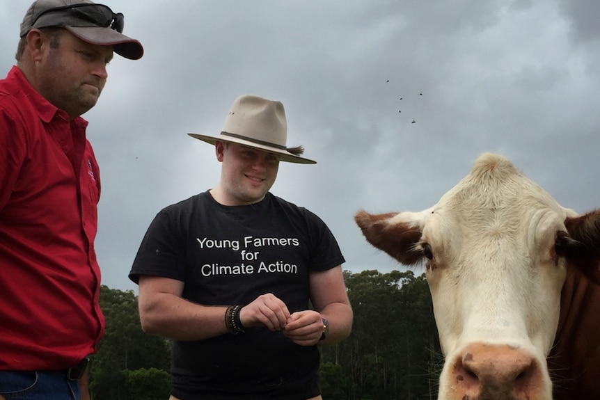 Josh and his father Andy Gilbert with a Brahford cow.