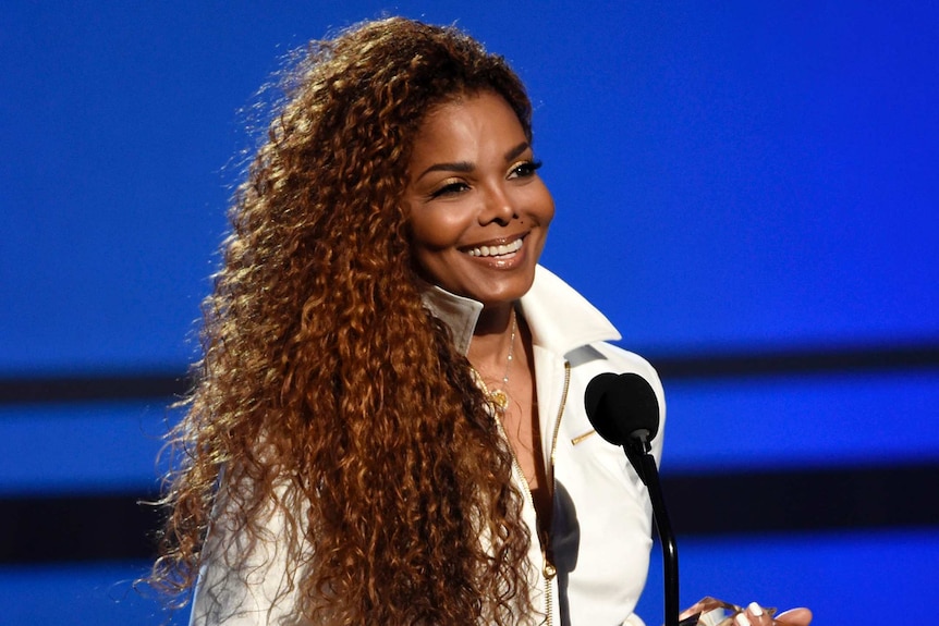 Janet Jackson smiles while accepting the ultimate icon: music dance visual award at the BET Awards in LA.