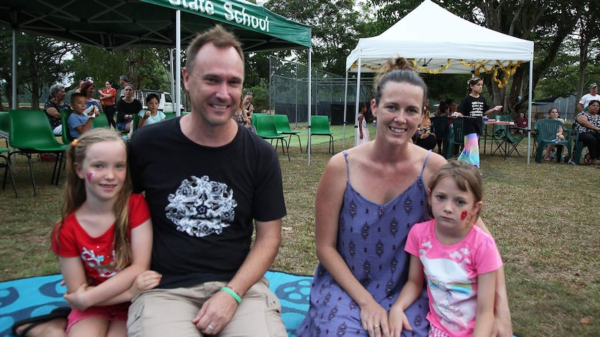 Non-Indigenous parent Erica Mast sits with her family in Mossman in far north Queensland in December 2018.