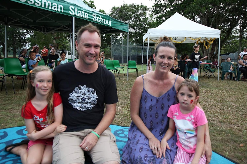 Non-Indigenous parent Erica Mast sits with her family in Mossman in far north Queensland in December 2018.